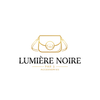 A minimalist logo graphic for 'LUMIÈRE NOIRE PARIS ACCESSORIES' on a solid white background. The design features a gold line-art illustration of a handbag above the brand name, which is written in black serif font, with 'PARIS ACCESSORIES' in smaller gold text below.